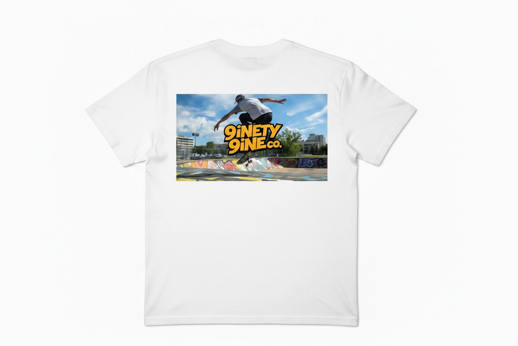 Skateboarder performing a trick at a skate park with '9inety9ine.co' branding.